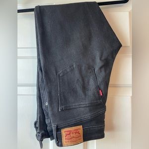 Levi's cropped mid rise skinny jeans in black with tie detail at calf